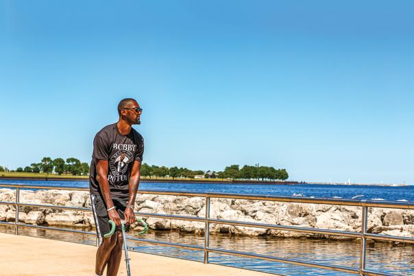 Bobby Portis riding a scooter in front of Lake Michigan