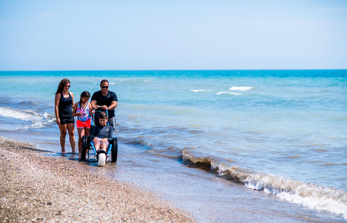 family of 4, son in wheelchair on Bradford Beach