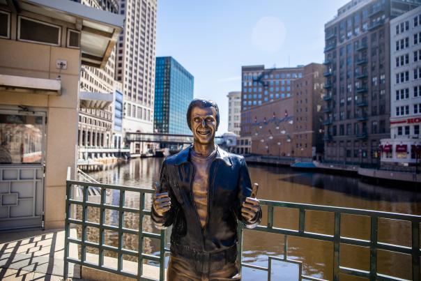 a bronze statue of the Happy Days character The Fonz on the Milwaukee RiverWalk