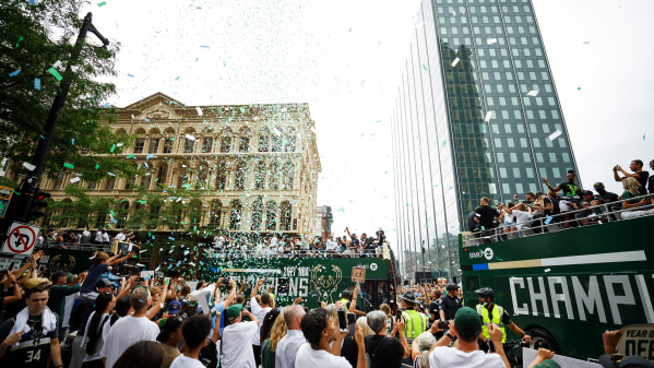 parade floats in the city, confetti in the air