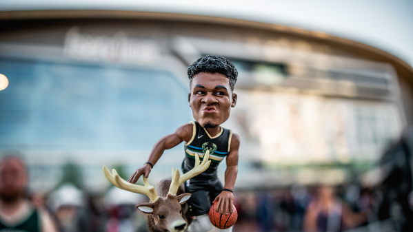 Giannis bobblehead in front of Fiserv Forum right before a game
