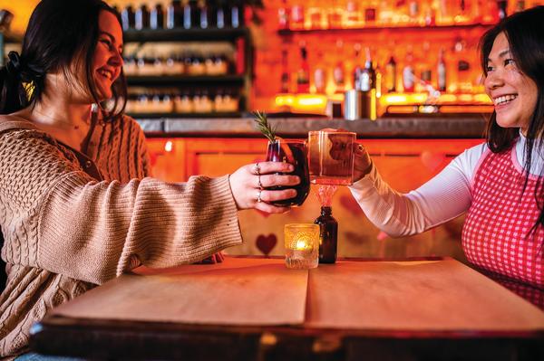 friends cheersing at table