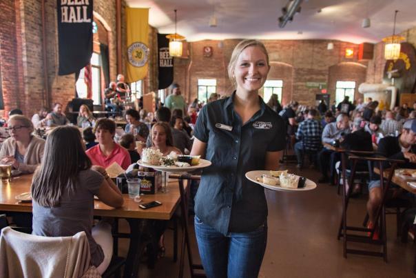 Server carrying plates at Lakefront Brewery