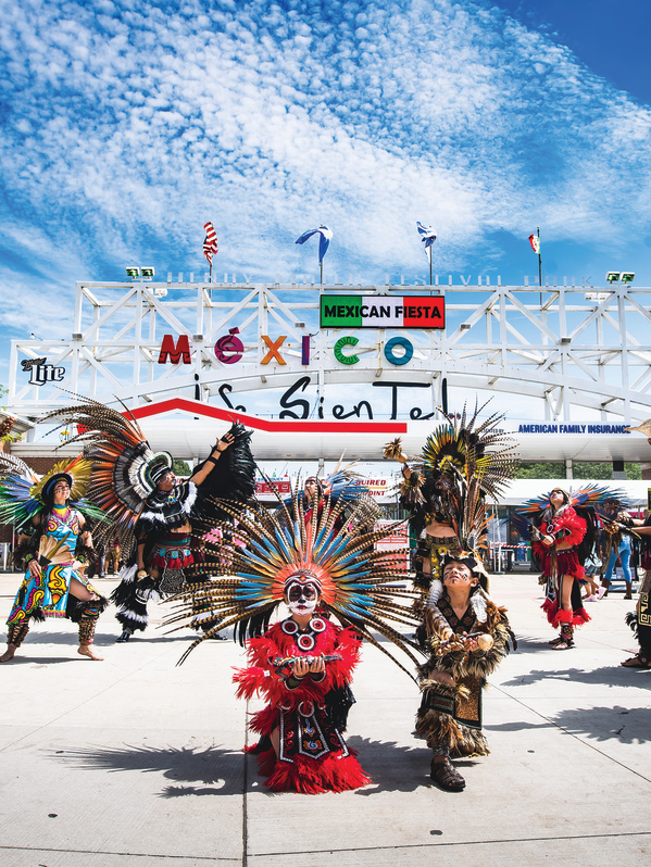 traditional Mexican dance in front of Mexican Fiesta festival grounds main gate