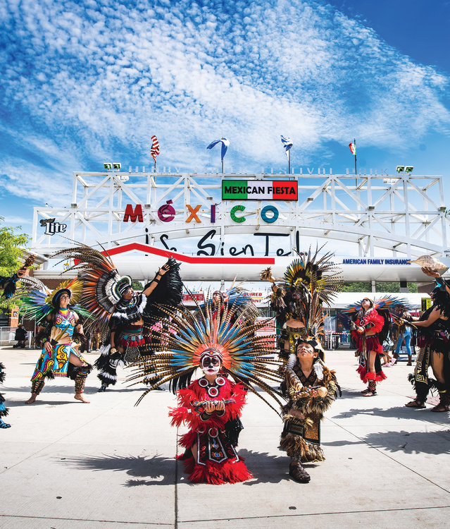 traditional Mexican dance in front of Mexican Fiesta festival grounds main gate