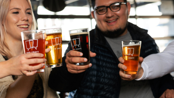 Friends cheersing beers