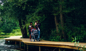 family walking on path at Schlitz Audubon Nature Center