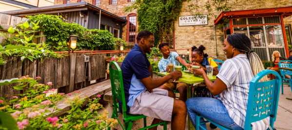 Black family dining on a patio